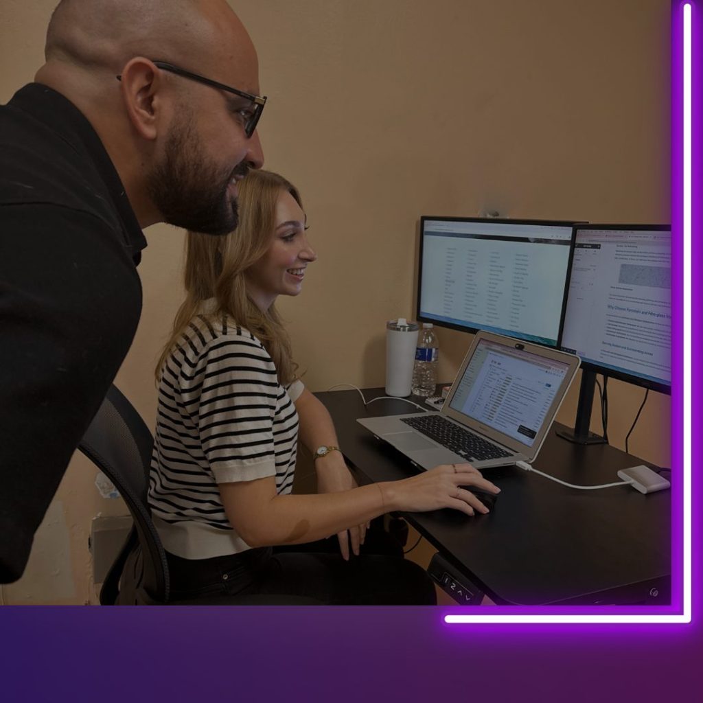 Lexie and Bryan looking at computer
